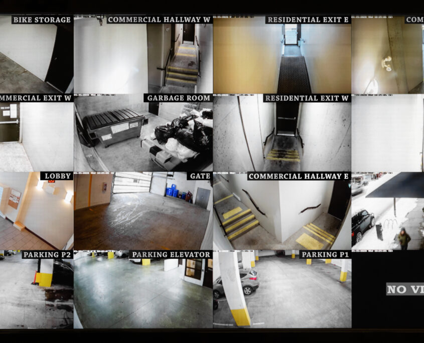 Security camera monitoring screen. 16 camera slots. Small high end system of residential, commercial or strata building. Parking, gate, garbage and recycling room, staircase and hallway